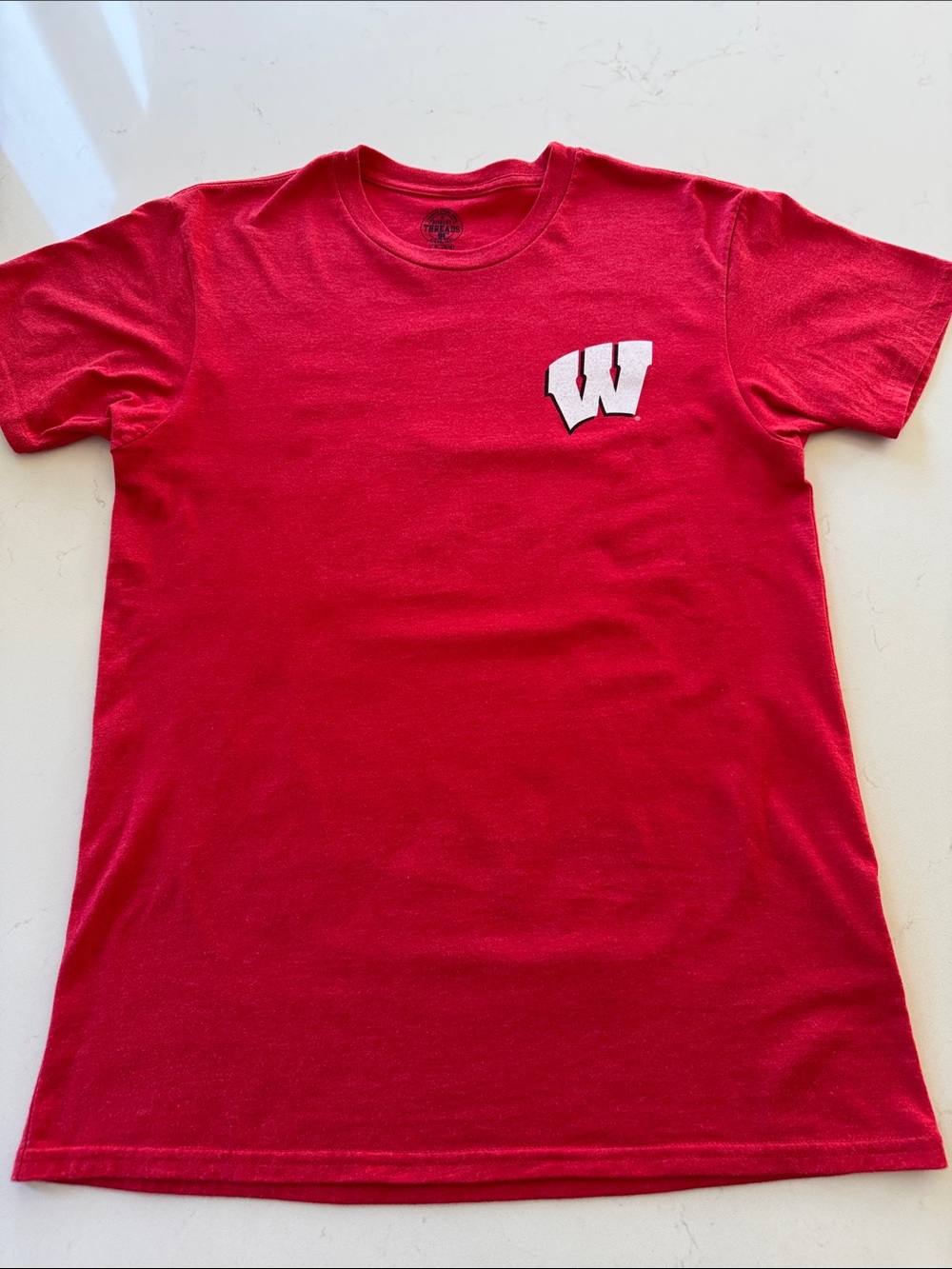 Wisconsin Badger Women's graphic tee with back graphic.  
Size: Medium